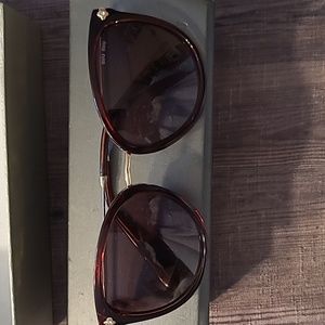 - Miu Miu Sunglasses